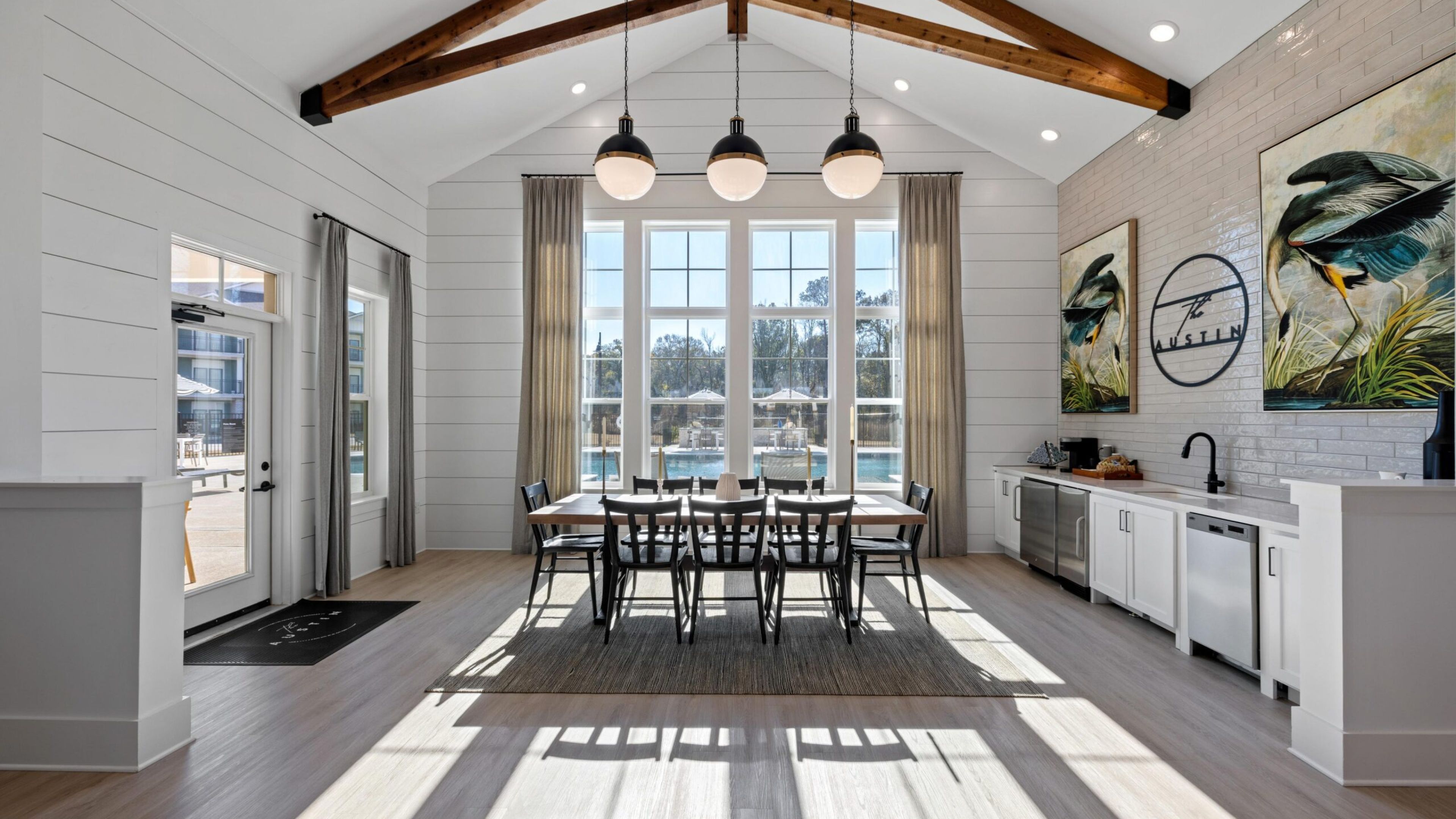 The Austin Apartment HomesThe Austin Apartment Homes Three women sitting on a couch, each focused on their smartphones, engaged in conversation and sharing moments.