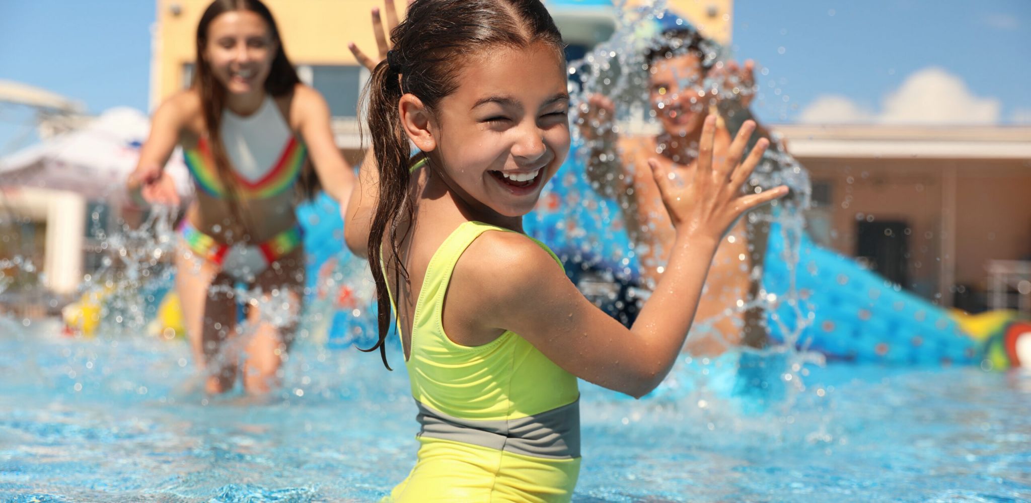 The Austin Apartment HomesThe Austin Apartment Homes Happy family having fun at water park. Summer vacation